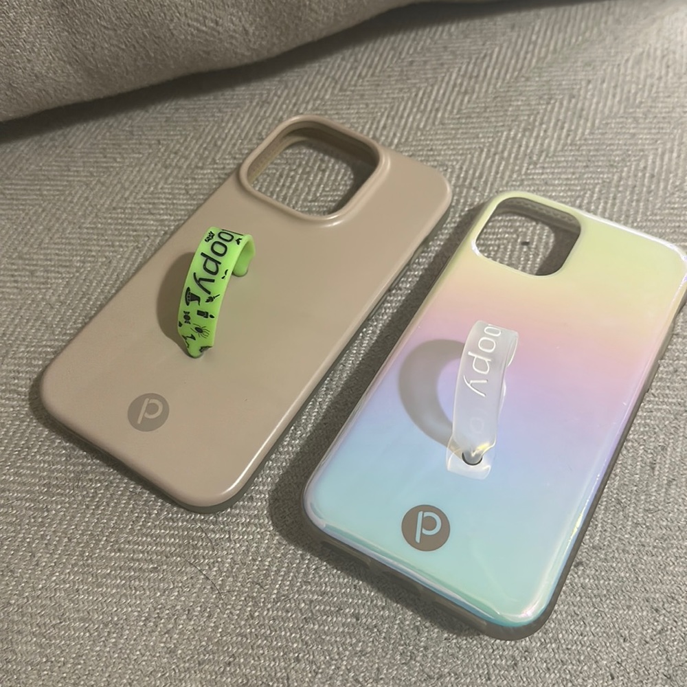 Two gently used iPhone 14 pro Loopy cases. Taupe/tan one has jean fade.